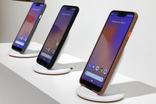 
              New Google Pixel 3 smartphones are displayed in New York, Tuesday, Oct. 9, 2018. Google introduced two new smartphones in its relentless push to increase the usage of its digital services and promote its Android software that already powers most of the mobile devices in the world.(AP Photo/Richard Drew)
            