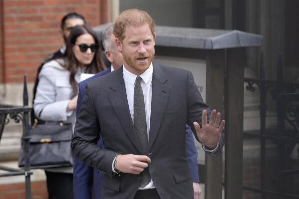 FILE - Britain's Prince Harry waves to the media as he leaves the Royal Courts Of Justice in London, Thursday, March 30, 2023. Prince Harry is expected to testify in a London courtroom in June in one of his phone hacking lawsuits against British tabloids. Lawyers for the Duke of Sussex said Wednesday, April 5 in High Court that he will probably testify in early to mid-June. (AP Photo/Kirsty Wigglesworth, file)