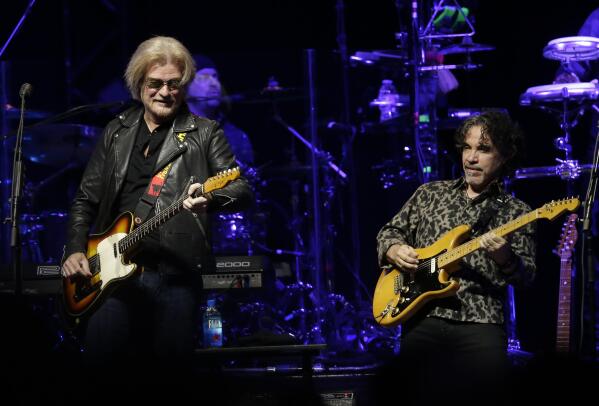 FILE - Daryl Hall and John Oates perform in Glendale, Ariz. on July 17, 2017.  The multi-platinum duo behind hits like ″Private Eyes,” ″Rich Girl” and “Maneater,” is ready to hit concert stages again. Their new tour kicks off Aug. 5 at Xfinity Center in Mansfield, Mass. (Photo by Rick Scuteri/Invision/AP, File)