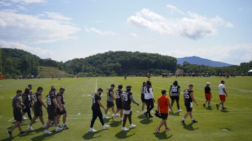 Members of the Cleveland Browns arrive at their team's NFL football training camp facility Saturday, July 22, 2023, in White Sulphur Springs, W.V. (AP Photo/Chris Carlson)