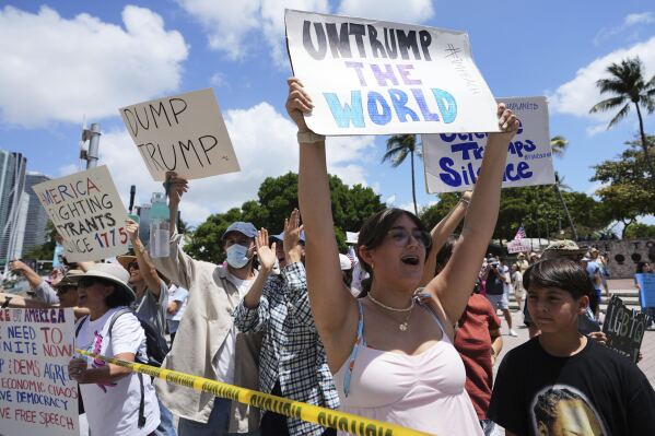 Amelie Gayoso chants slogans during a protest against the Trump administration, Saturday, April 19, 2025, in Miami. (AP Photo/Lynne Sladky)