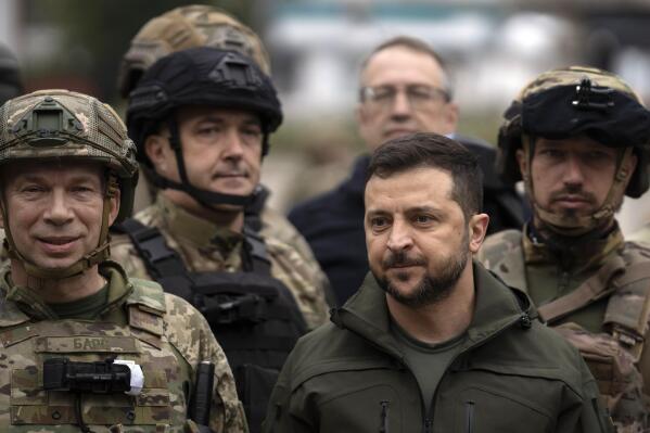 FILE - Ukrainian President Volodymyr Zelenskyy poses for a photo with soldiers after attending a flag-raising ceremony in the recaptured city of Izium, Ukraine, on Sept. 14, 2022. Zelenskyy has ruled out any talks with Russia until it withdraws all of its forces from Ukrainian territory, including Crimea. (AP Photo/Leo Correa, File)