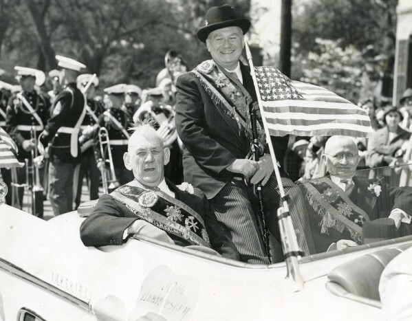 This March 17, 1956 photo shows, from left, Joseph A. Rossiter, Edward A. Leonard, and Charles F. Powers riding in the annual Savannah St. Patrick's Day Parade. Savannah, Georgia's oldest city, is planning a supersized celebration as it marks the 200th anniversary of its beloved St. Patrick's Day parade. City Manager Jay Melder says he's expecting historic crowds for the Irish-themed parade Saturday, March 16, 2024. (Savannah Morning News via AP)