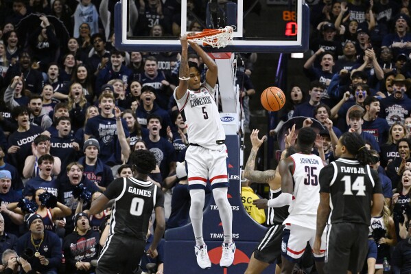 UConn guard Stephon Castle (5) dunks the ball in the first half of an NCAA college basketball game against Providence, Wednesday, Jan. 31, 2024, in Storrs, Conn. (AP Photo/Jessica Hill)