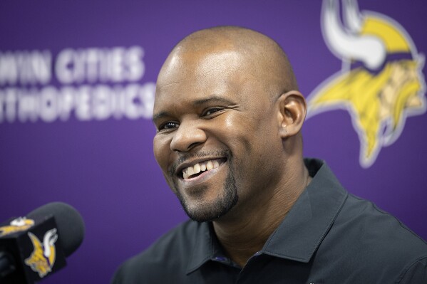 FILE - Minnesota Vikings new defensive coordinator Brian Flores is introduced during an NFL football news conference, Wednesday, Feb. 15, 2023, in Eagan, Minn. A federal judge said Tuesday, July 25, that she’s not changing her decision to let NFL coach Brian Flores put the league and three of its teams on trial over his claims that he and other Black coaches face discrimination.(Elizabeth Flores/Star Tribune via AP, File, File)/Star Tribune via AP, File)