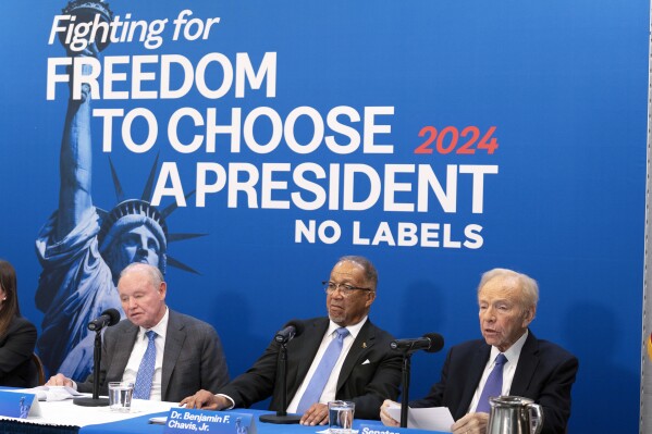 FILE - No Labels leadership and guests from left, Dan Webb, National Co-Chair Dr. Benjamin F. Chavis, and founding Chairman and former Sen. Joe Lieberman, speak about the 2024 election at National Press Club, in Washington, Jan. 18, 2024. The third-party presidential movement No Labels is expected to move this week toward fielding a presidential candidate in the November election. (AP Photo/Jose Luis Magana, File)