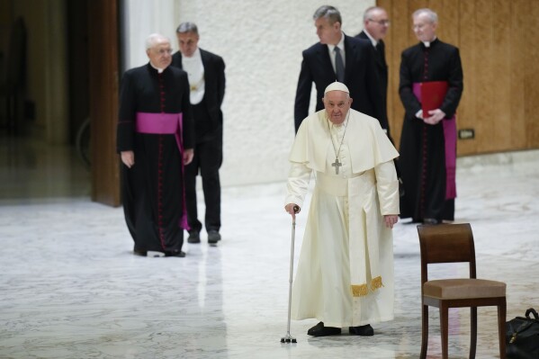 Pope Francis arrives for an audience with sick people and Lourdes pilgrimage operators in the Paul VI Hall, at the Vatican, Thursday, Dec. 14, 2023. (AP Photo/Alessandra Tarantino)