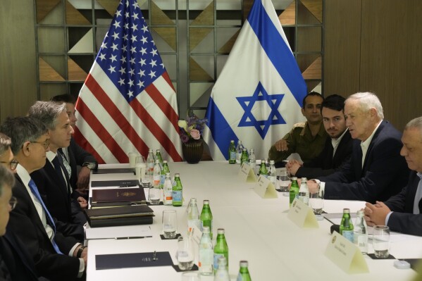 U.S. Secretary of State Antony Blinken meets with former Israel Defense Forces (IDF) chief Gadi Eisenkot, right, and former Israeli Defense Minister Benny Gantz in Tel Aviv, Israel, Thursday, Feb. 8, 2024. (AP Photo/Mark Schiefelbein, Pool)