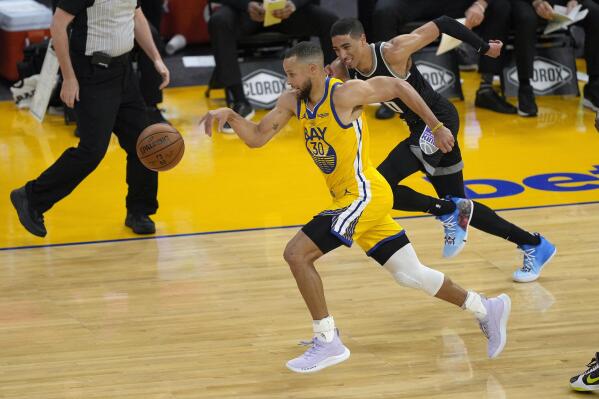 Golden State Warriors guard Stephen Curry (30) steals the ball from Sacramento Kings guard Tyrese Haliburton (0) during the first half of an NBA basketball game on Sunday, April 25, 2021, in San Francisco. (AP Photo/Tony Avelar)