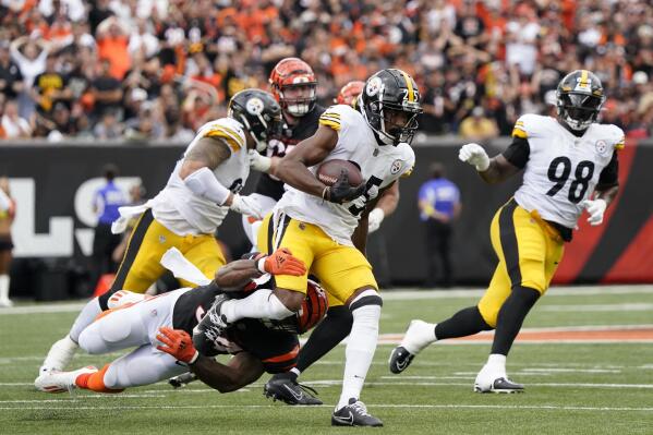 Pittsburgh Steelers cornerback Ahkello Witherspoon is tackled by Cincinnati Bengals running back Samaje Perine after an interception during the second half of an NFL football game, Sunday, Sept. 11, 2022, in Cincinnati. (AP Photo/Joshua A. Bickel)