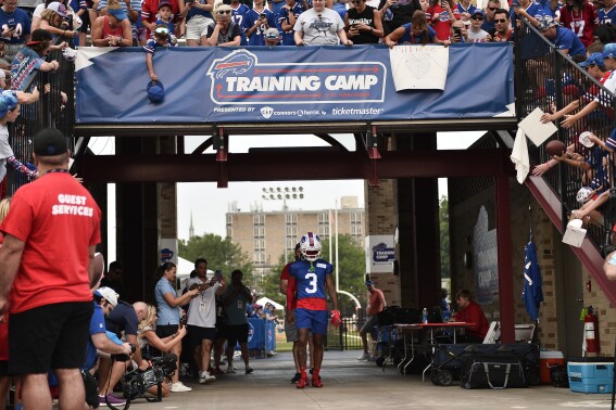 Buffalo Bills safety Damar Hamlin (3) walks to the field before practice at the NFL football team's training camp in Pittsford, N.Y., Wednesday, July 26, 2023. (AP Photo/Adrian Kraus)