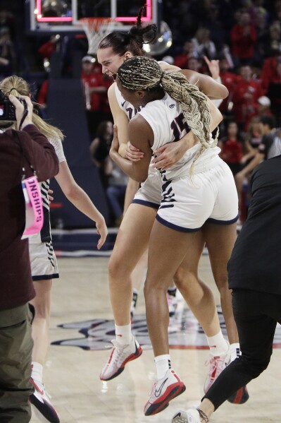 Gonzaga forwards Yvonne Ejim (15) and forward Maud Huijbens celebrate the team's win against against Utah in a second-round college basketball game in the NCAA Tournament in Spokane, Wash., Monday, March 25, 2024. (AP Photo/Young Kwak)