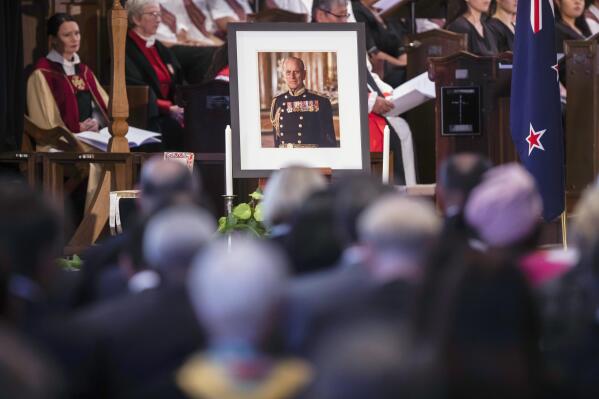 A portrait of Prince Philip is display during a national memorial service for the Prince held at the Cathedral of St. Paul, Wednesday, April 21, 2021, in Wellington, New Zealand. Prince Philip was remembered as frank, engaging and willing to meet people from all walks of life during his 14 visits to the country. (Robert Kitchin/Pool via AP)