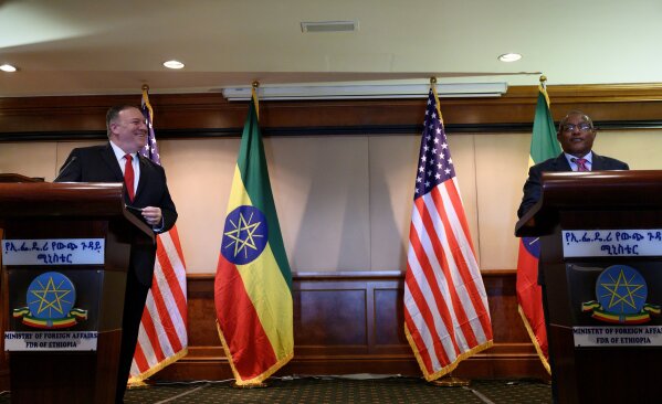 U.S. Secretary of State Mike Pompeo, left, takes part in a joint press conference with Ethiopian Foreign Minister Gedu Andargachew, right, at the Sheraton Hotel, in Addis Ababa, Ethiopia, Tuesday Feb. 18, 2020. America’s top diplomat in his final Africa stop has discussed political reforms with Ethiopia’s Nobel Peace Prize-winning prime minister, and Ethiopia says the U.S. plans to provide “substantial financial support.” (Andrew Caballero-Reynolds/Pool Photo via AP)
