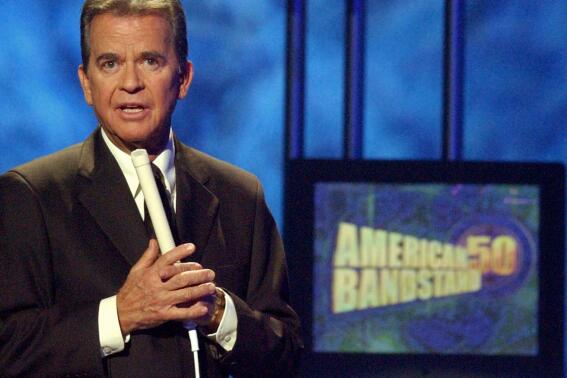 FILE - In this April 20, 2002 file photo, Dick Clark, host of the American Bandstand television show, introduces entertainer Michael Jackson on stage during taping of the show's 50th anniversary special in Pasadena, Calif. Clark, the television host who helped bring rock `n' roll into the mainstream on "American Bandstand," died  April 18, 2012 of a heart attack. He was 82. (AP Photo/Kevork Djansezian, File)