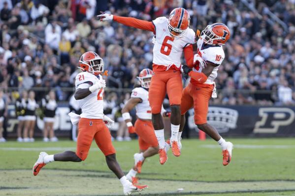 Illinois wide receivers Deuce Spann (6) and Desmond Dan Jr. (10) celebrate during the fourth quarter of an NCAA college football game against Purdue, Saturday, Sept. 25, 2021, in West Lafayette, Ind. (Nikos Frazier/Journal & Courier via AP)