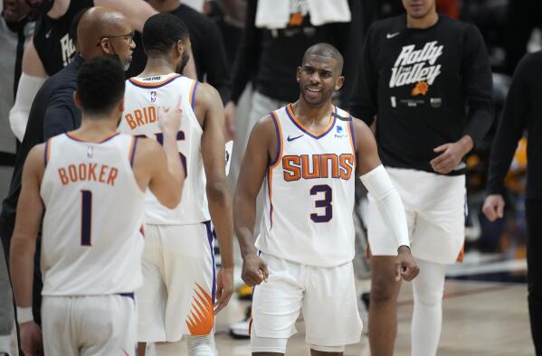 Phoenix Suns guard Chris Paul congratulates teammates during a timeout in the second half of Game 4 of an NBA second-round playoff series against the Denver Nuggets, Sunday, June 13, 2021, in Denver. (AP Photo/David Zalubowski)