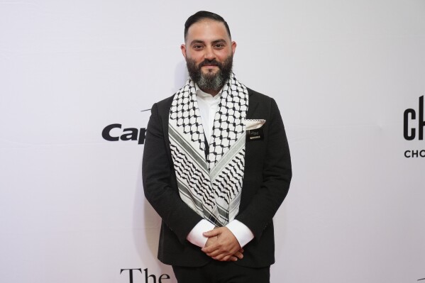 Chef Michael Rafidi of Albi in Washington, D.C., stands on the red carpet before the James Beard Awards ceremony Monday, June 10, 2024, in Chicago. Rafidi won the James Beard award for Outstanding Chef. (ĢӰԺ Photo/Erin Hooley)