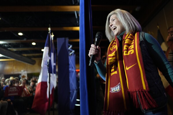 Sen. Joni Ernst, R-Iowa, introduces Republican presidential candidate Nikki Haley during a campaign event in Ames, Iowa on Sunday. (AP Photo/Carolyn Kaster)