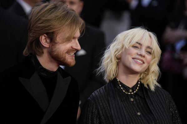 FILE - Finneas O'Connell, left, and Billie Eilish poses for photographers upon arrival for the World premiere of the new film from the James Bond franchise "No Time To Die," in London, on Sept. 28, 2021. Beyoncé and Billie Eilish will perform their nominated songs at Sunday's Oscars, the film academy announced Tuesday, March 22, 2022. Eilish and her brother and co-writer Finneas will perform “No Time To Die” from the James Bond film of the same name. (AP Photo/Matt Dunham, File)