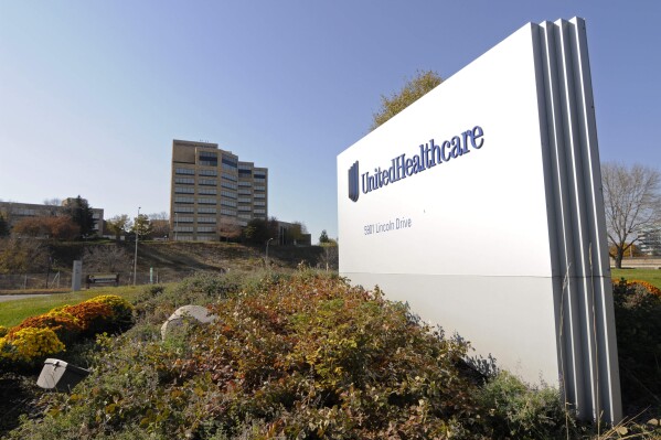 FILE - A sign stands on UnitedHealth Group Inc.'s campus in Minnetonka, Minn., Oct. 16, 2012. UnitedHealth Group topped second-quarter expectations but stayed cautious on its outlook for the year as it continued to eat costs from a massive cyberattack to its Change Healthcare business. The health care giant said Tuesday, July 16, 2024, it still expects adjusted earnings to fall between $27.50 and $28 in 2024, an outlook it first predicted last fall. (AP Photo/Jim Mone, File)