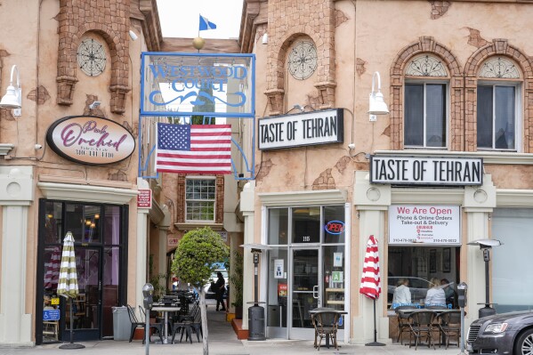 The Pink Orchid bakery and cafe and the Taste of Tehran restaurant are seen in the so-called "Tehrangeles" neighborhood in the Westwood district of Los Angeles on Monday, May 20, 2024. (AP Photo/Damian Dovarganes)