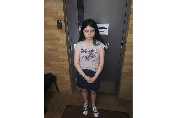 FILE - This July 2023 photo provided by the Havre, Mont., Police Department shows Alicia Navarro, 18, at the police station in Havre. The 36-year-old boyfriend of the Arizona teenager who mysteriously disappeared four years ago before suddenly appearing in a small Montana town in 2022, has been charged with two felony counts of child sexual abuse based on images found on his phone, authorities said Tuesday, Oct. 24, 2023. (Havre Police Department via AP, File)