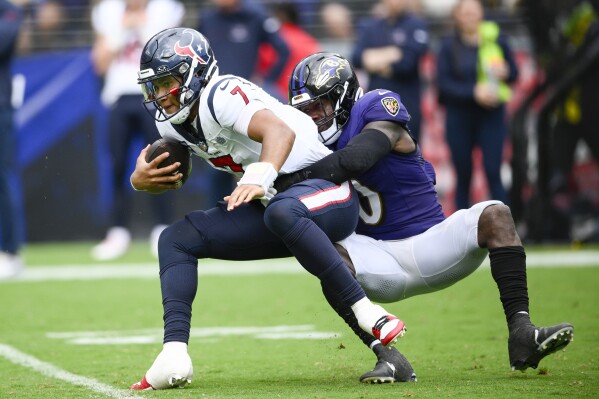 Baltimore Ravens' Roquan Smith sacks Houston Texans' C.J. Stroud during the second half of an NFL football game Sunday, Sept. 10, 2023, in Baltimore. (AP Photo/Nick Wass)