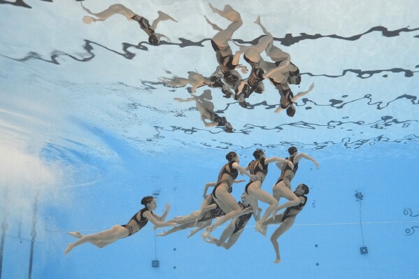 Spain team compete in the mixed team acrobatic of artistic swimming at the 老澳门六合彩 Aquatics Championships in Doha, Qatar, Saturday, Feb. 3, 2024. (AP Photo/Lee Jin-man)