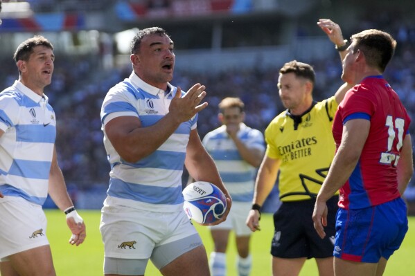 Argentina's Agustin Creevy celebrates scoring a try against Chile during a Rugby World Cup Pool D match at the Stade de la Beaujoire in Nantes, France, Saturday, Sept. 30, 2023. (AP Photo/Themba Hadebe)