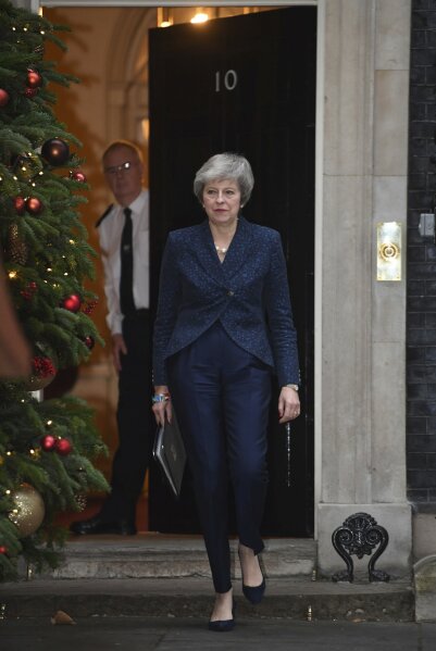 
              Britain's Prime Minister Theresa May prepares to make a media statement in Downing Street, London, confirming there will be a vote of confidence in her leadership of the Conservative Party, Wednesday Dec. 12, 2018.  The vote of confidence will be held in Parliament Wednesday evening, with the result expected to be announced soon after. (Stefan Rousseau/PA via AP)
            