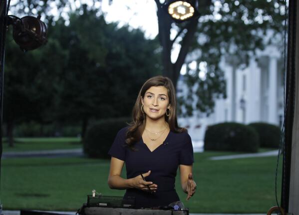 FILE - CNN White House correspondent Kaitlan Collins during a live shot in front of the White House in Washington, July 25, 2018. Donald Trump's town hall forum on CNN on Wednesday, May 10, 2023, is the first major TV event of the 2024 presidential campaign, and a big test for the chosen moderator, Kaitlan Collins. The former White House correspondent and now-morning show host must juggle questions from an audience of Republican primary voters, her own follow-ups and the need to fact-check false statements. (AP Photo/Alex Brandon, File)