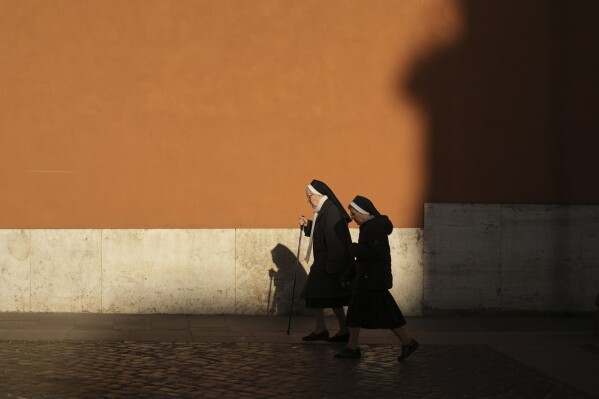 Nuns walk to Vatican City, Tuesday, April 22, 2025. (AP Photo/Francisco Seco)