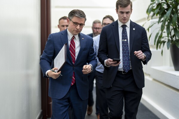 House Speaker Mike Johnson, R-La., left, arrives for a closed-door meeting with fellow Republicans at the Capitol in Washington, Monday, April 15, 2024. (AP Photo/J. Scott Applewhite)