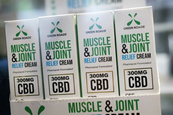 Muscle Joint & Relief Cream is displayed at the Cannabis World Congress & Business Exposition trade show, Thursday, May 30, 2019 in New York. The non-prescription cream is marketed by Green Roads of Deerfield Beach, Flor. (AP Photo/Mark Lennihan)
