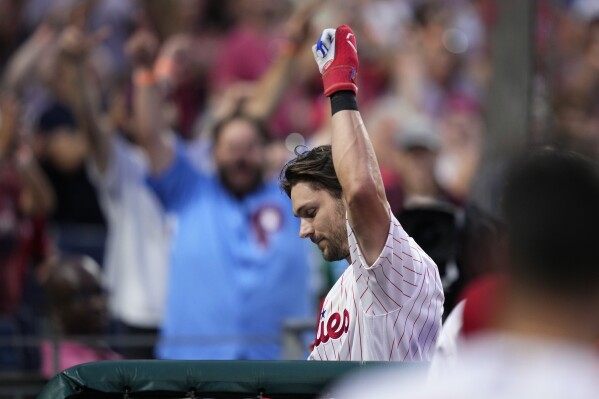 Philadelphia Phillies' Trea Turner acknowledges the crowd after hitting a three-run home run during the sixth inning of a baseball game against the Kansas City Royals, Saturday, Aug. 5, 2023, in Philadelphia. (AP Photo/Matt Slocum)