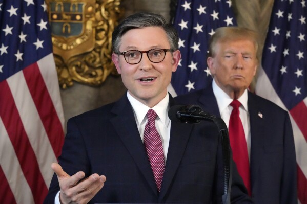 Speaker of the House Mike Johnson, R-La., speaks as Republican presidential candidate former President Donald Trump listens during a news conference, Friday, April 12, 2024, at Mar-a-Lago in Palm Beach, Fla. (AP Photo/Wilfredo Lee)