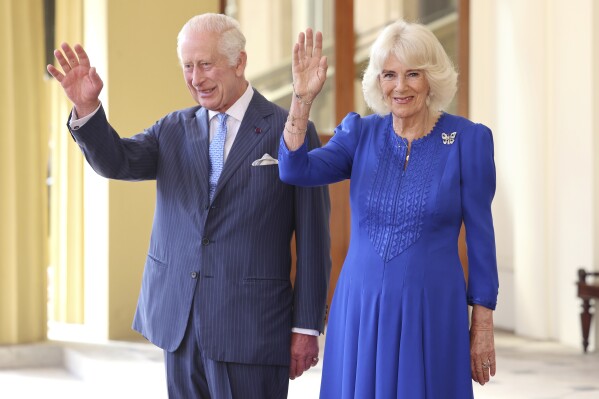 FILE - Britain's King Charles III and Queen Camilla, wave as they formally bid farewell to Japan's Emperor Naruhito and Empress Masako on the final day of their state visit to Britain at Buckingham Palace, London, Thursday, June 27, 2024. King Charles III is preparing to visit Australia and Samoa in October 2024, an itinerary that will span 12 time zones and test the monarch’s stamina as he recovers from cancer treatment. The trip was announced on Sunday, July 14, 2024, by Buckingham Palace. (Chris Jackson/Pool Photo via AP, File)