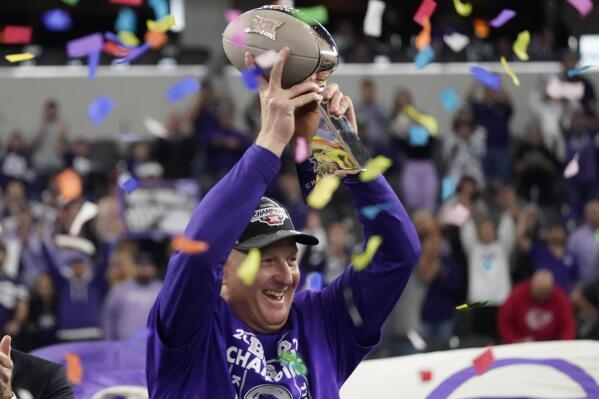 FILE - Kansas State head coach Chris Klieman holds the trophy after Kansas State defeated TCU in the Big 12 Conference championship NCAA college football game, Saturday, Dec. 3, 2022, in Arlington, Texas. Kansas State and Chris Klieman are close to finalizing a new contract that would give the Wildcats' football coach a substantial pay raise while keeping him tied to the program for the next eight seasons, a person familiar with the deal told The Associated Press on Monday, May 8, 2023. (AP Photo/LM Otero, File)