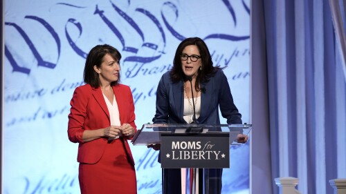 Moms for Liberty founders Tiffany Justice, right, and Tina Descovich speak at the Moms for Liberty meeting in Philadelphia, Friday, June 30, 2023. (AP Photo/Matt Rourke)