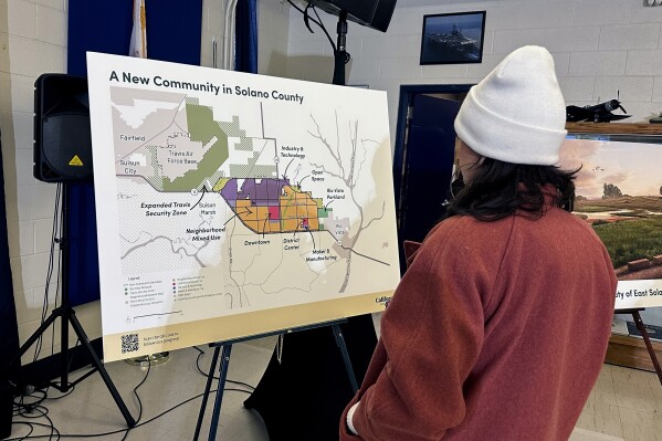 FILE - A map of a new proposed community in Solano County, Calif., is displayed during a news conference in Rio Vista, Calif. on Jan. 17, 2024. A Silicon Valley-backed initiative to build a green city for up to 400,000 people in the San Francisco Bay Area has qualified for the Nov. 5 ballot. Voters will be asked to allow urban development on land currently zoned for agriculture. (AP Photo/Janie Har, File)