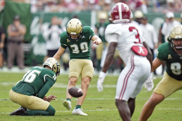 South Florida place kicker John Cannon (39) kicks a field goal against Alabama during the first half of an NCAA college football game Saturday, Sept. 16, 2023, in Tampa, Fla. (AP Photo/Chris O'Meara)