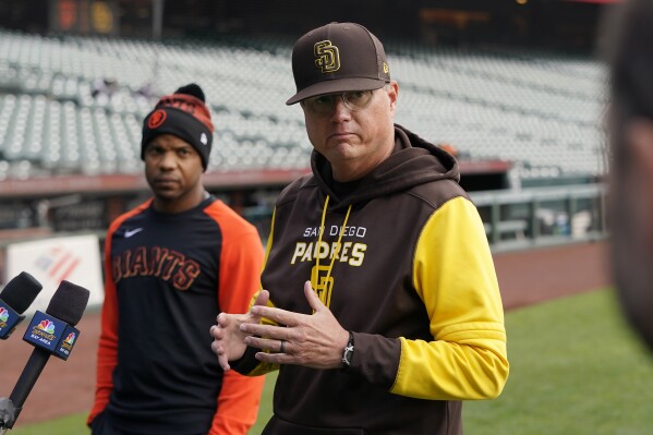 FILE - Then-San Diego Padres third base coach Mike Shildt, right, speaks at a news conference next to San Francisco Giants first base coach Antoan Richardson before a baseball game in San Francisco on April 13, 2022. Shildt has been hired as manager of the San Diego Padres, returning to the dugout two years after he was suddenly fired by the St. Louis Cardinals following a third straight playoff appearance, a person with knowledge of the situation said Tuesday, Nov. 21, 2023. (AP Photo/Jeff Chiu, File)