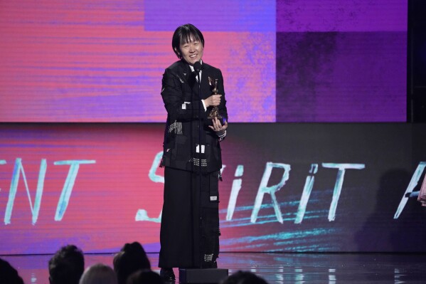 Celine Song accepts the award for best director for "Past Lives" during the Film Independent Spirit Awards on Sunday, Feb. 25, 2024, in Santa Monica, Calif. (AP Photo/Chris Pizzello)