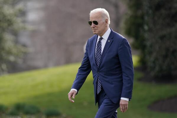 President Joe Biden walks on the South Lawn of the White House before boarding Marine One, Friday, March 18, 2022, in Washington. Biden is spending the weekend at his home in Rehoboth Beach, Del. (AP Photo/Patrick Semansky)