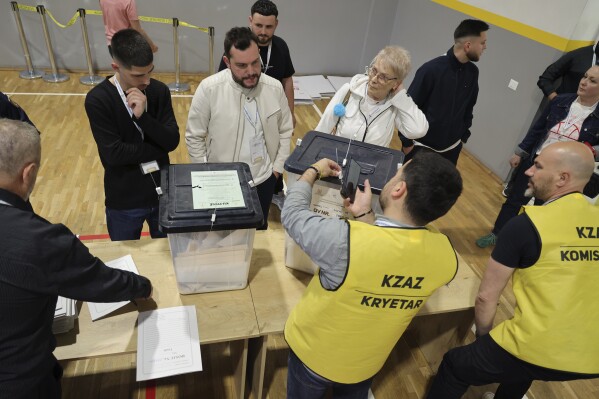 Ballot boxes are checked following the end of the voting procedure in Albania's parliamentary election after a boisterous campaign dominated by the country's uphill effort to join the European Union and Prime Minister Edi Rama's bid for a fourth term, in Tirana, Albania, Sunday, May 11, 2025. (AP Photo/Vlasov Sulaj)