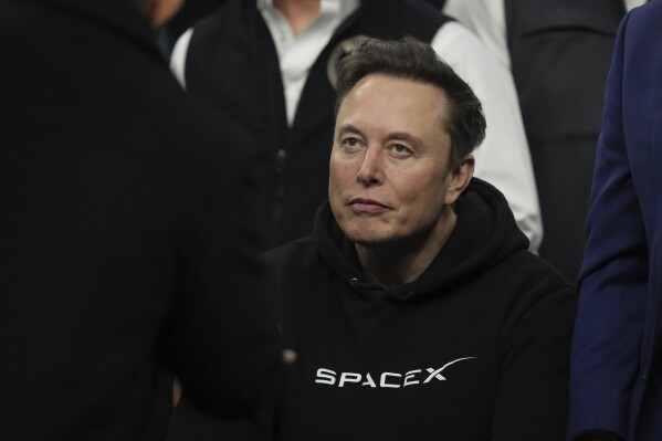 Elon Musk attends the finals for the NCAA wrestling championship, Saturday, March 22, 2025, in Philadelphia. (AP Photo/Matt Rourke, File)