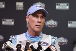 FILE - Kevin Harvick is shown during NASCAR Daytona 500 auto racing media day at Daytona International Speedway, Wednesday, Feb. 16, 2022, in Daytona Beach, Fla. Kevin Harvick is a fading star trying to keep pace in a NASCAR that is more and more suited for younger drivers. But he heads to Martinsville Speedway coming off a second-place finish that showed Harvick still has plenty in his tank. (AP Photo/John Raoux, File)