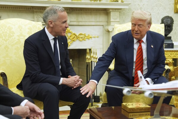President Donald Trump meets Canadian Prime Minister Mark Carney in the Oval Office of the White House, Tuesday, May 6, 2025, in Washington. (AP Photo/Evan Vucci)
