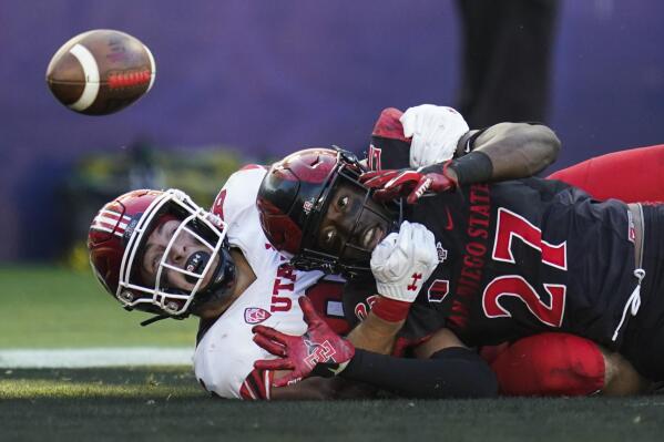 Utah tight end Dalton Kincaid (86) and San Diego State safety Cedarious Barfield (27) try to catch a pass intended for Kincaid in the end zone during the first half of an NCAA college football game Saturday, Sept. 18, 2021, in Carson, Calif. The pass was incomplete. (AP Photo/Ashley Landis)